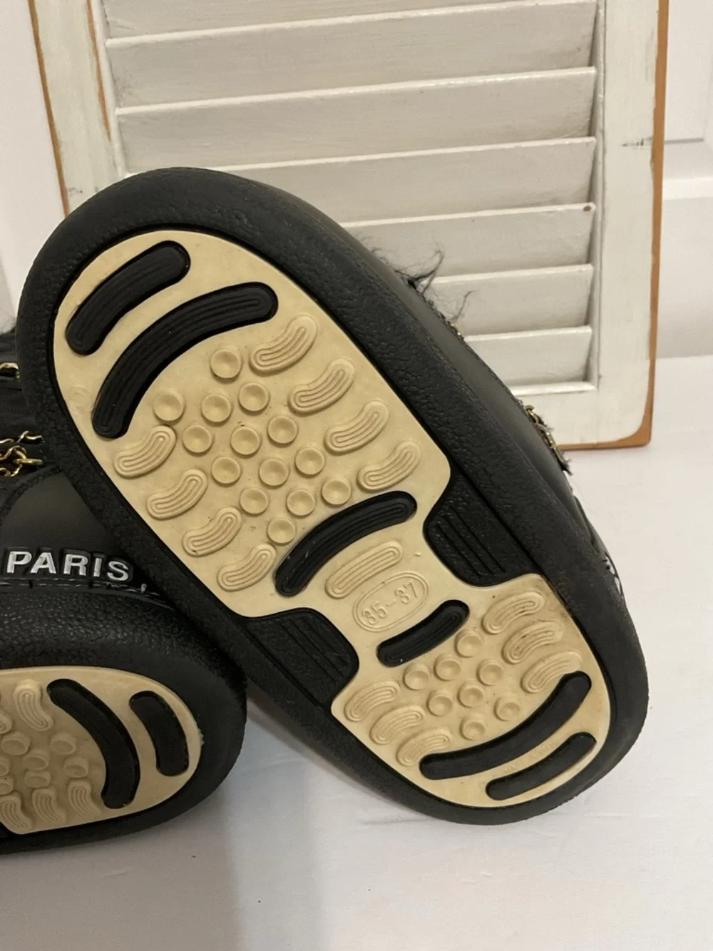 CHANEL Black and Gold Quilted Winter Lace-Up Boots